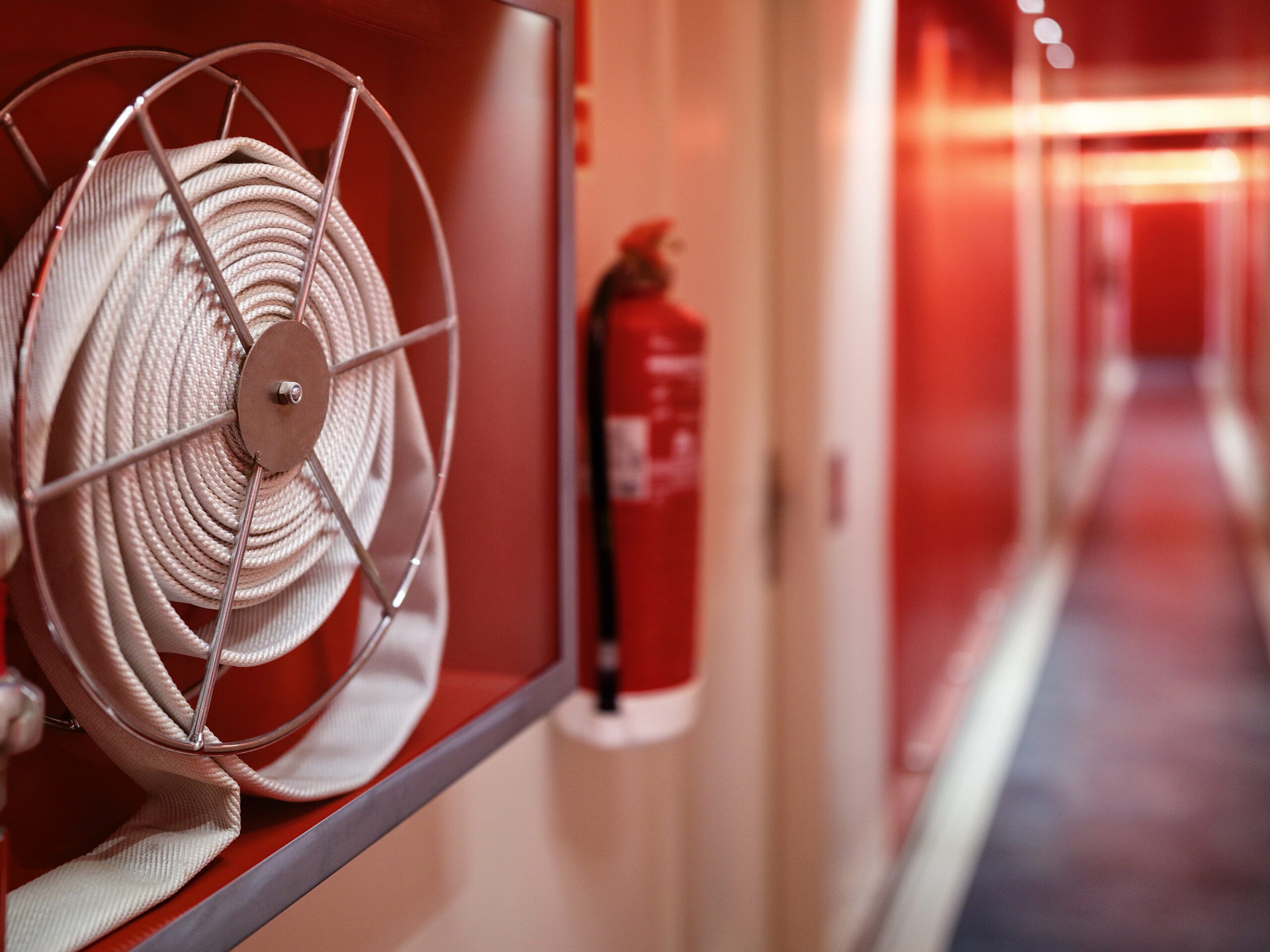 Fire extinguisher and hose reel on the hotel floor